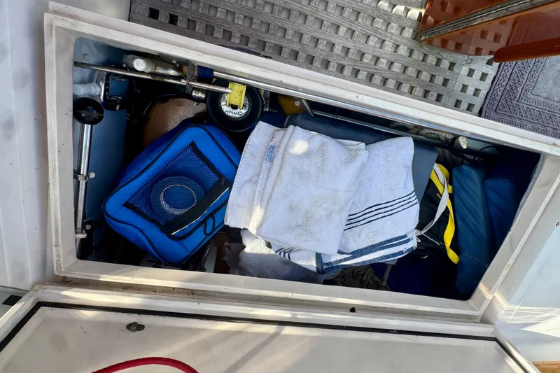 Fandango Yacht Photos Pics Storage compartment on a 1982 Hinckley Bermuda 40 MK III sailboat with towels and gear.