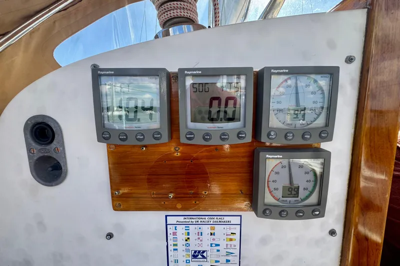 Fandango Yacht Photos Pics Hinckley Bermuda 40 MK III 1982 sailboat dashboard with Raymarine instruments and navigation chart.