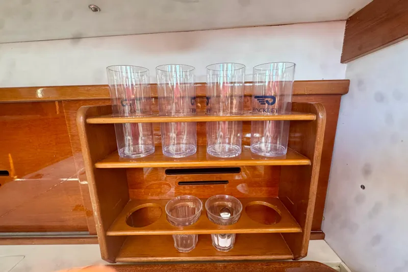 Fandango Yacht Photos Pics Wooden cup holder with Hinckley glasses on a 1982 Bermuda 40 MK III yacht.