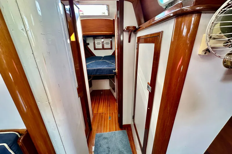 Fandango Yacht Photos Pics Interior of 1982 Hinckley Bermuda 40 MK III sailboat with wooden finishes and cozy cabin.