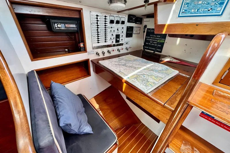 Fandango Yacht Photos Pics Navigation station of 1982 Hinckley Bermuda 40 MK III with chart and control panel.