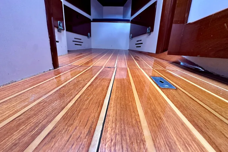Fandango Yacht Photos Pics Interior view of 1982 Hinckley Bermuda 40 MK III with polished wooden flooring.