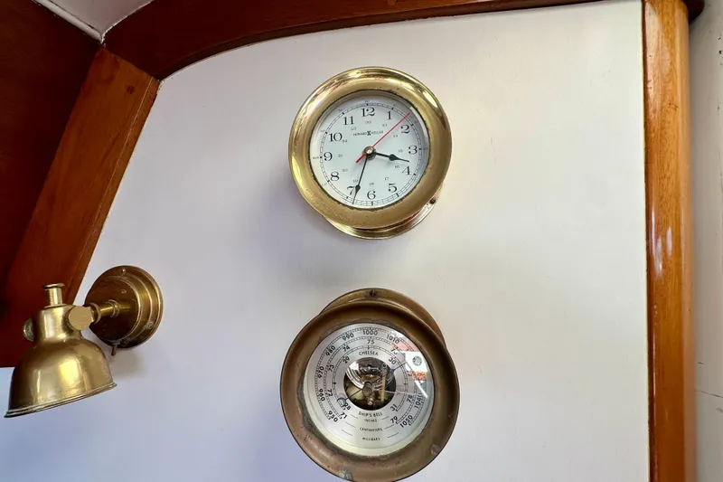 Fandango Yacht Photos Pics Brass clock and barometer on 1982 Hinckley Bermuda 40 MK III yacht interior.