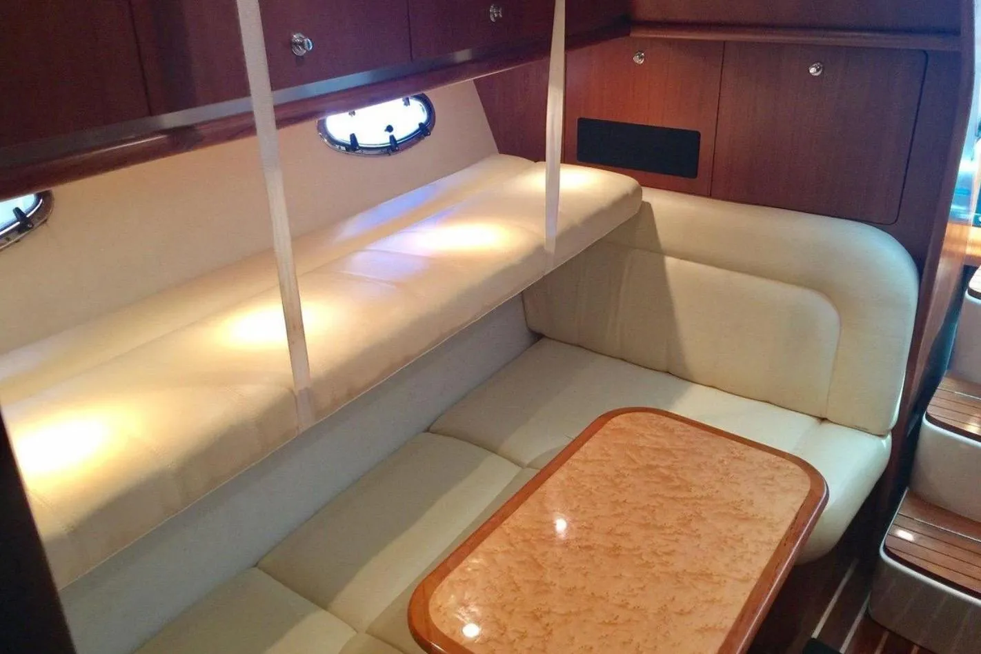 2005 Tiara Yachts 3600 Open interior with cozy seating and elegant wood finishes.