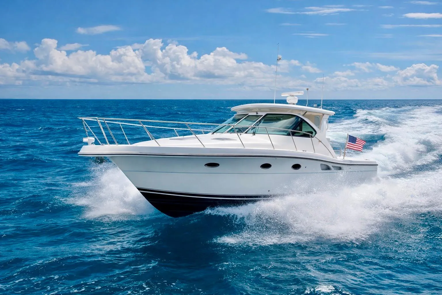 2005 Tiara Yachts 3600 Open cruising on the ocean under a clear blue sky.