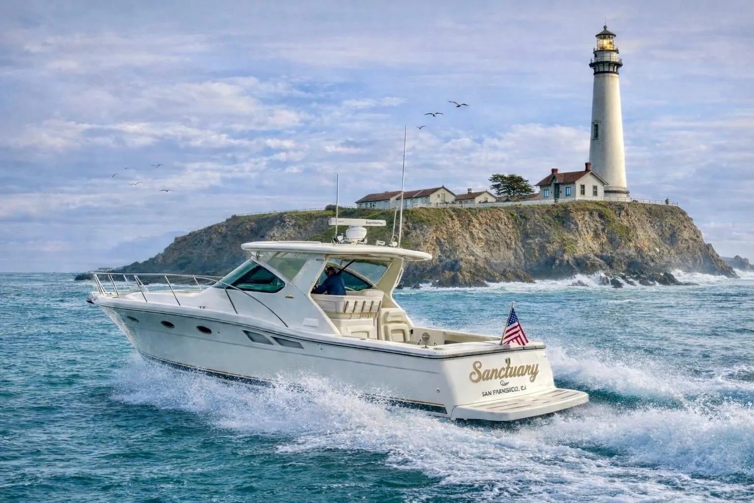 2005 Tiara Yachts 3600 Open cruising near a lighthouse on rocky coastline.