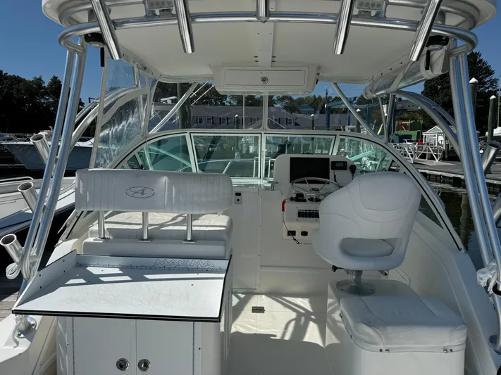 Destiny Yacht Photos Pics 2012 Albemarle 280 XF Express boat interior with helm and seating area.