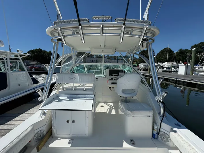 Destiny Yacht Photos Pics 2012 Albemarle 280 XF Express boat interior at marina, featuring helm and seating area.