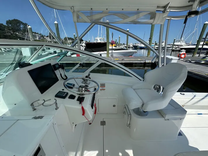 Destiny Yacht Photos Pics 2012 Albemarle 280 XF Express boat cockpit with steering wheel and navigation equipment.
