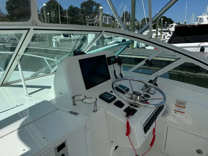 Destiny Yacht Photos Pics 2012 Albemarle 280 XF Express boat helm with steering wheel and navigation equipment.
