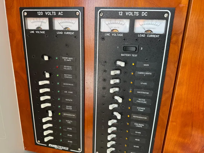 Destiny Yacht Photos Pics Electrical panel of a 2012 Albemarle 280 XF Express boat, showing AC and DC voltage controls.