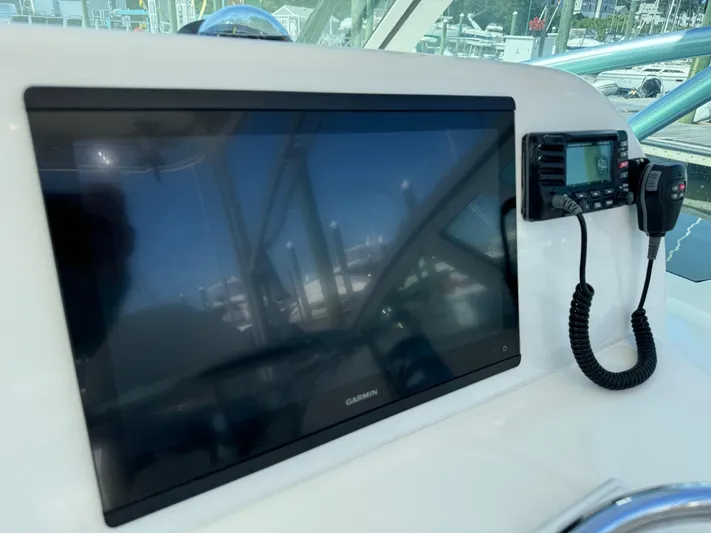 Destiny Yacht Photos Pics 2012 Albemarle 280 XF Express boat dashboard with Garmin display and radio.