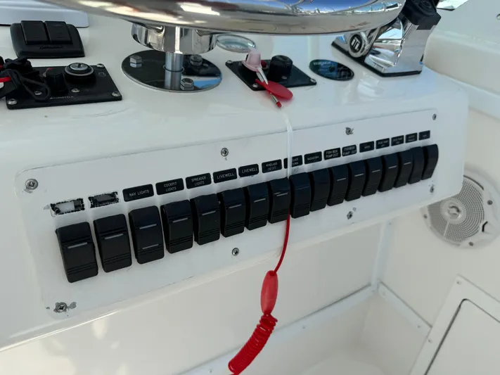 Destiny Yacht Photos Pics Control panel of 2012 Albemarle 280 XF Express boat with switches and safety lanyard.