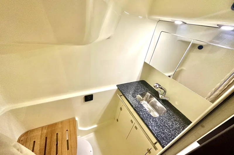 Favorite Mistake Yacht Photos Pics 2013 Monterey 400 Sport Yacht bathroom with sink, mirror, and wooden seat.