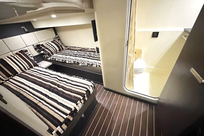 Favorite Mistake Yacht Photos Pics 2013 Monterey 400 Sport Yacht interior with twin beds and bathroom.