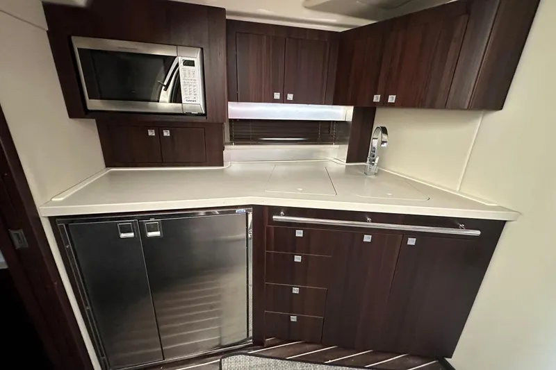 Favorite Mistake Yacht Photos Pics Luxurious kitchen in 2013 Monterey 400 Sport Yacht with modern appliances and sleek cabinetry.