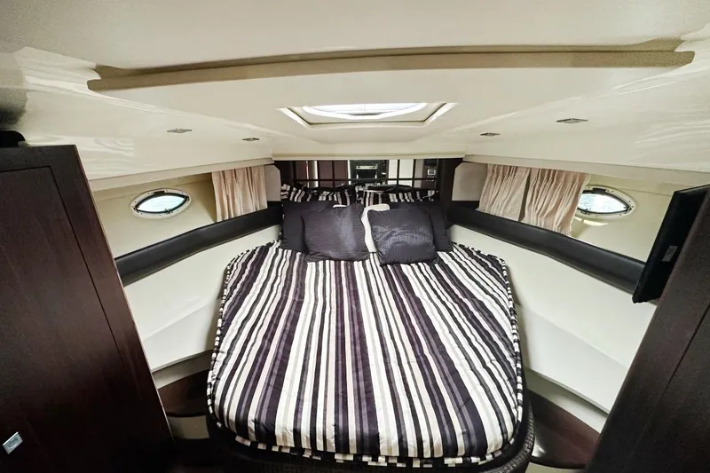 Favorite Mistake Yacht Photos Pics Luxurious cabin interior of 2013 Monterey 400 Sport Yacht with striped bedding.