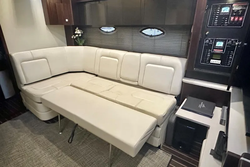 Favorite Mistake Yacht Photos Pics Luxurious interior of 2013 Monterey 400 Sport Yacht with cream leather seating and control panels.