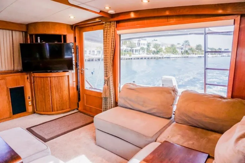 Wonderer Yacht Photos Pics Luxurious interior of 1987 Bertram 54 Convertible yacht with waterfront view.