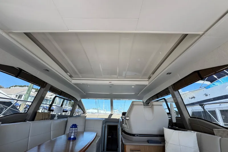 Aquaholique Yacht Photos Pics Interior of 2017 Sea Ray Sundancer 460 yacht, featuring modern seating and large windows.