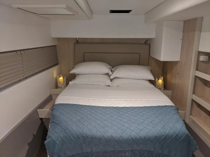 La Grande Bellezza Yacht Photos Pics Luxurious bedroom interior in 2019 Leopard 58 yacht with cozy bedding and ambient lighting.