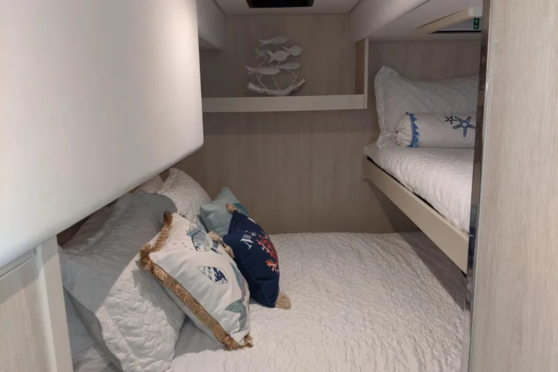 La Grande Bellezza Yacht Photos Pics Cozy bedroom in 2019 Leopard 58 yacht with nautical-themed decor.