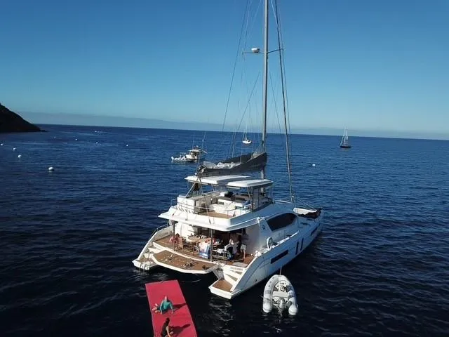 La Grande Bellezza Yacht Photos Pics Luxurious 2019 Leopard 58 yacht anchored in serene blue waters.