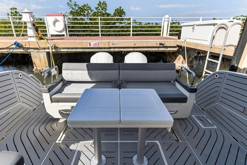 Penny's Escape Yacht Photos Pics 2024 Galeon 375 GTO boat interior with seating and table.