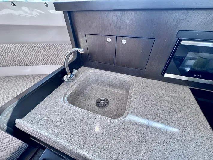 Seanior Moment Yacht Photos Pics Modern kitchen sink in 2022 Stamas 370 Aegean boat with sleek countertop design.