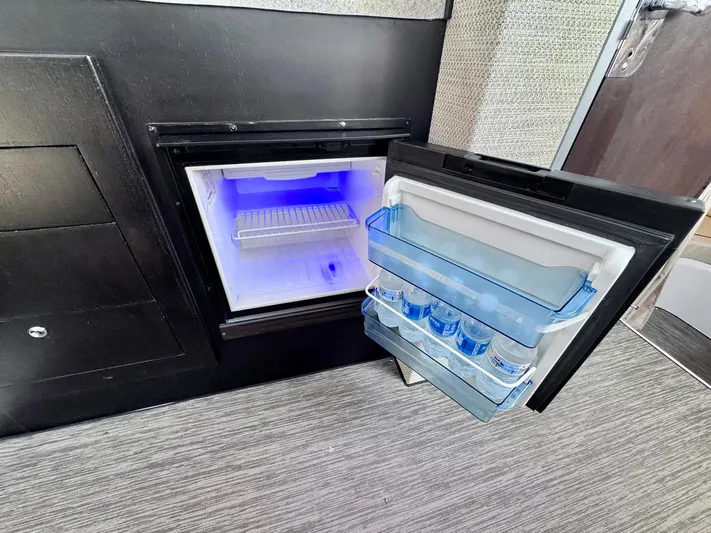 Seanior Moment Yacht Photos Pics Open mini fridge with blue interior light on Stamas 370 Aegean, 2022 model.