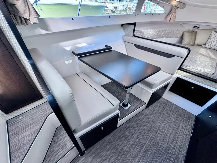 Seanior Moment Yacht Photos Pics 2022 Stamas 370 Aegean interior with modern seating and table setup.