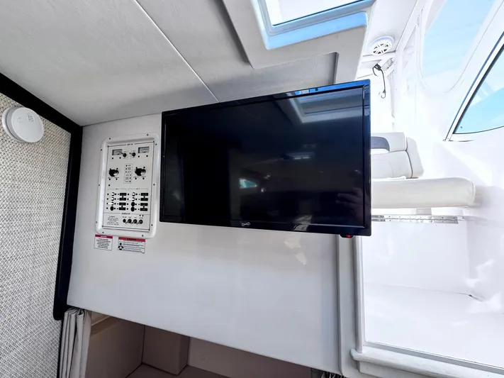 Seanior Moment Yacht Photos Pics 2022 Stamas 370 Aegean interior with mounted TV and control panel.