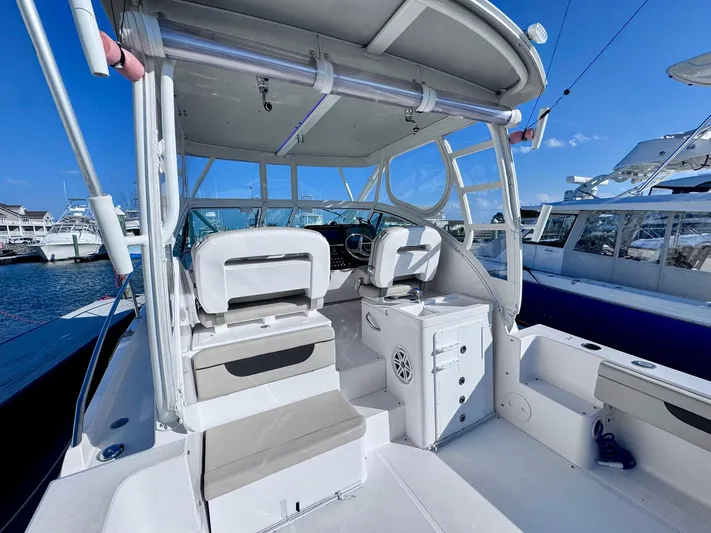 Seanior Moment Yacht Photos Pics 2022 Stamas 370 Aegean boat interior with helm and seating at marina.