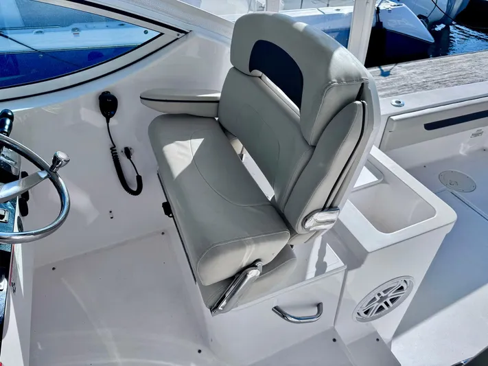 Seanior Moment Yacht Photos Pics Stamas 370 Aegean 2022 boat interior with helm seat and steering wheel.
