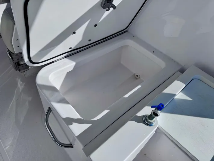 Seanior Moment Yacht Photos Pics Open storage compartment on 2022 Stamas 370 Aegean boat, featuring a sleek white design.