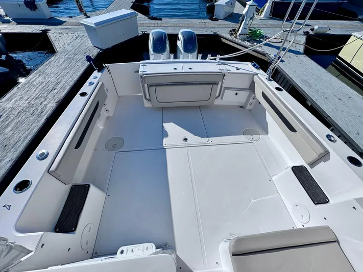 Seanior Moment Yacht Photos Pics 2022 Stamas 370 Aegean boat deck with dual engines at dock.