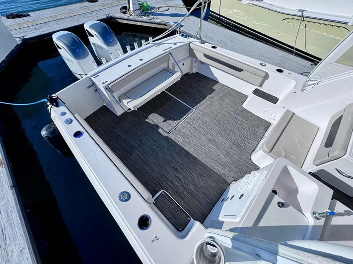 Seanior Moment Yacht Photos Pics 2022 Stamas 370 Aegean boat deck with seating and twin outboard motors.