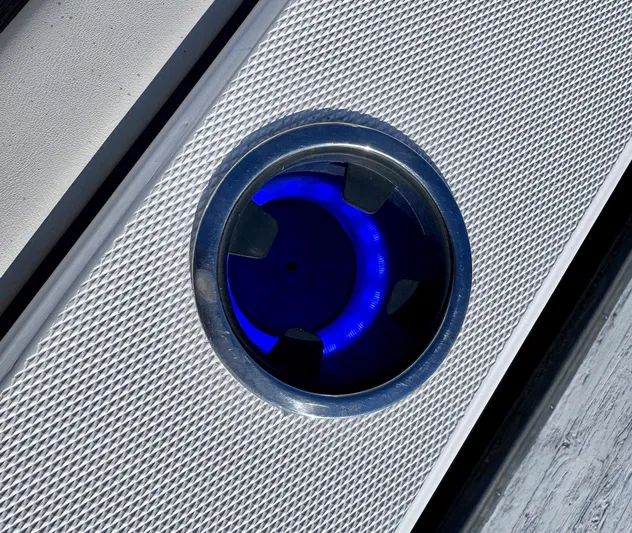 Seanior Moment Yacht Photos Pics Close-up of a blue LED light on a 2022 Stamas 370 Aegean boat.