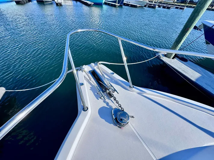 Seanior Moment Yacht Photos Pics Stamas 370 Aegean 2022 boat bow with anchor, docked in marina.