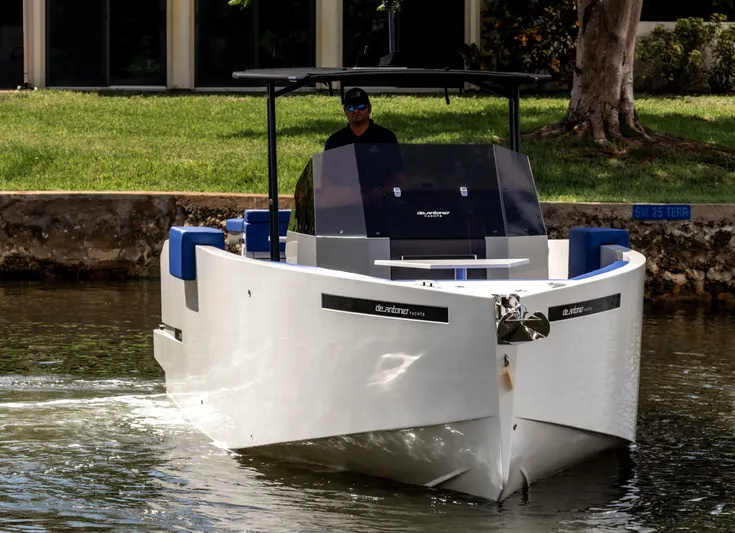  Yacht Photos Pics 2024 De Antonio Yachts D28 Open cruising on a calm waterway, modern design visible.