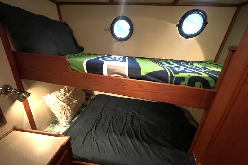 Lagnaf Yacht Photos Pics Bunk beds in 2002 Nordic Tug 37 cabin with porthole windows.