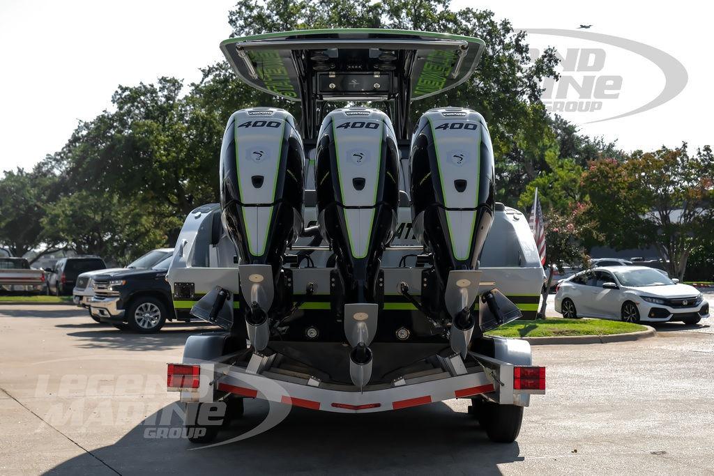 2024 Statement 350 Open boat with triple 400 horsepower engines, parked outdoors.