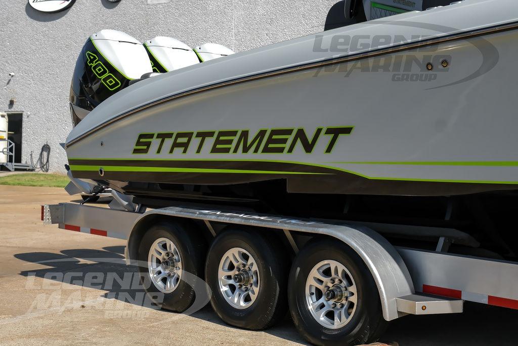 2024 Statement 350 Open boat on trailer, featuring bold green accents and triple engines.