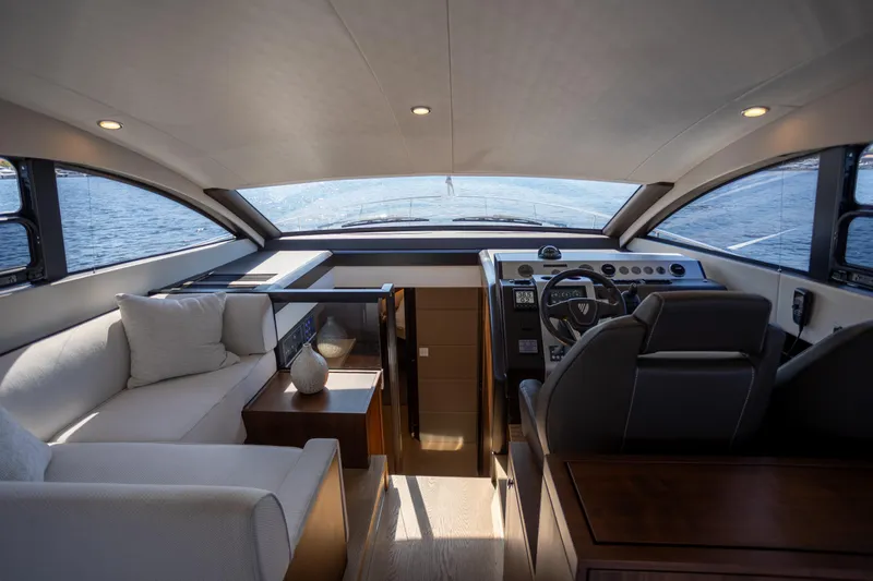50 Fairline Yacht Photos Pics Luxurious interior of 2025 Fairline Squadron 50 yacht, featuring modern helm and comfortable seating.