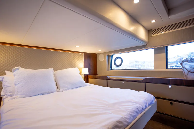 50 Fairline Yacht Photos Pics Luxurious bedroom interior of 2025 Fairline Squadron 50 yacht with elegant bedding.