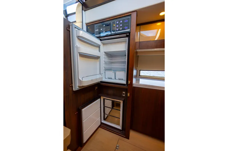 50 Fairline Yacht Photos Pics Luxury yacht Fairline Squadron 50 (2025) interior with open refrigerator and freezer.