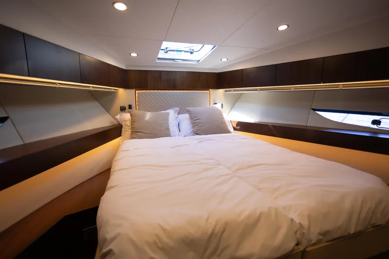 50 Fairline Yacht Photos Pics Luxurious cabin interior of 2025 Fairline Squadron 50 yacht with cozy bedding.
