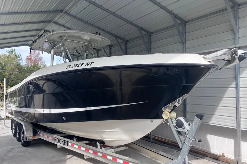  Yacht Photos Pics 2008 Hydra-Sports Vector 2900 CC boat on trailer in covered storage.