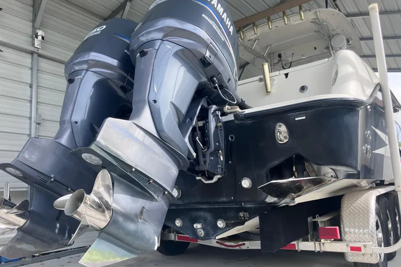  Yacht Photos Pics 2008 Hydra-Sports Vector 2900 CC with dual Yamaha outboard engines in a covered storage.