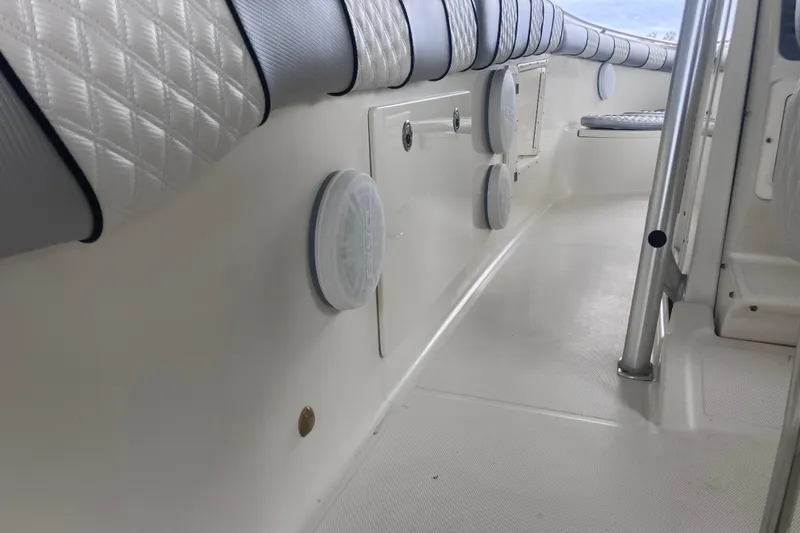  Yacht Photos Pics 2008 Hydra-Sports Vector 2900 CC interior with cushioned seating and marine speakers.